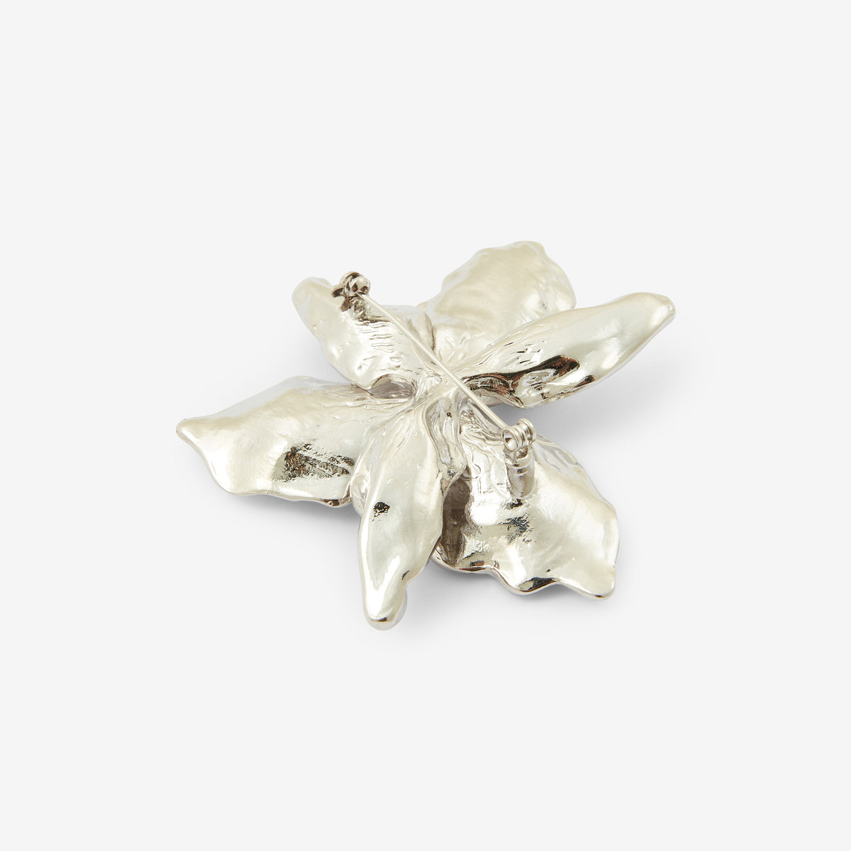 Broche fleur en métal argentée