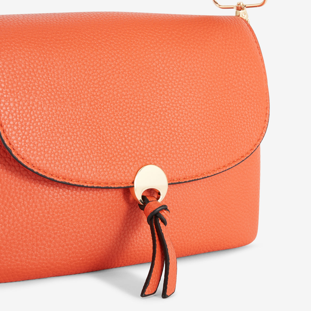 Petit sac orange avec bandoulière à motif géométrique