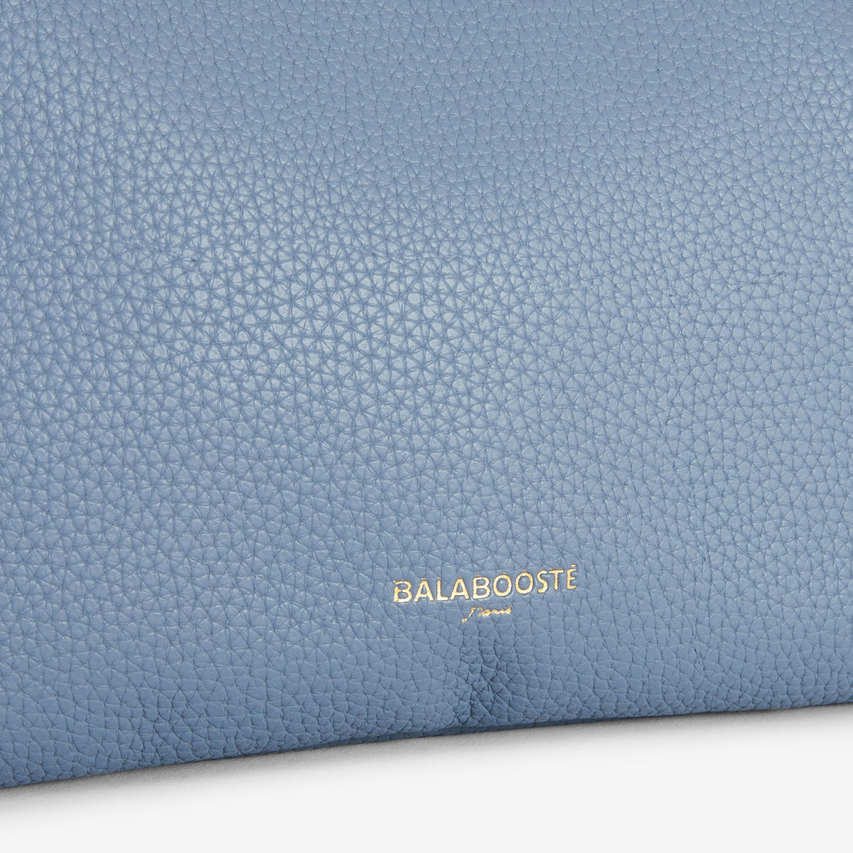 Pochette bleue multi‑poches avec bandoulière motif géométrique