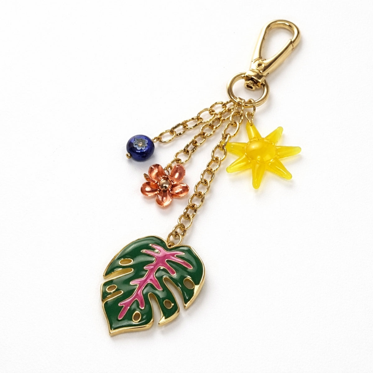 Porte-clés soleil, fleur et feuille de monstera