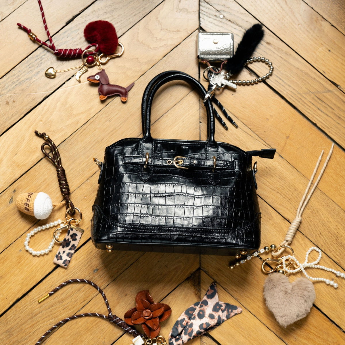 Bijoux de sac mini sac argenté et pompon noir