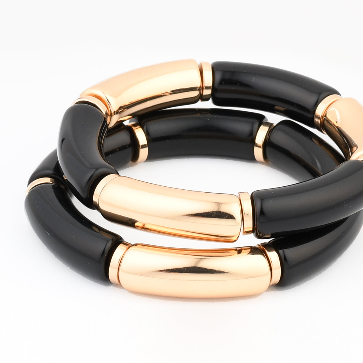 Set de 2 bracelets tubes noirs et dorés