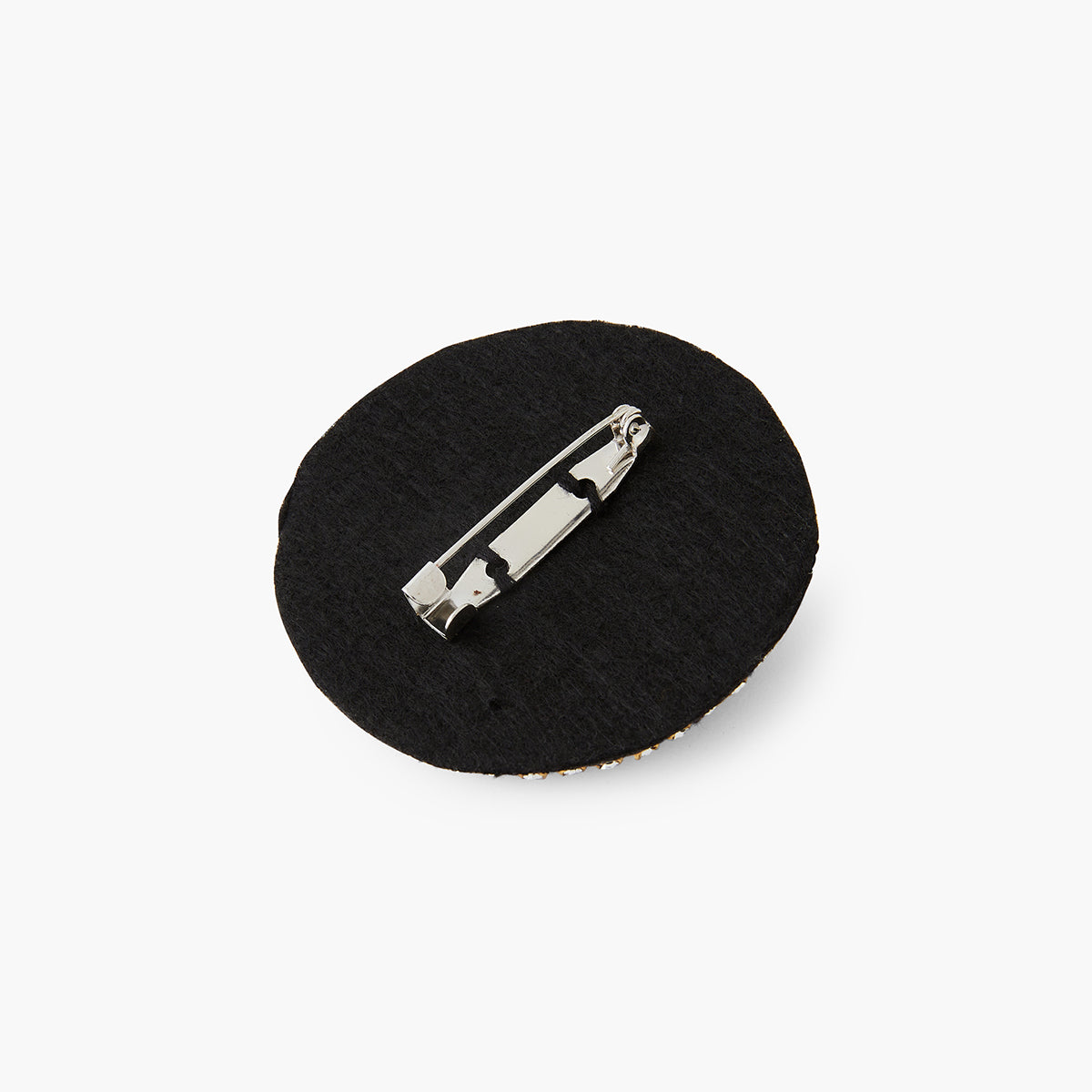 Broche ronde motif œil en perle de rocaille