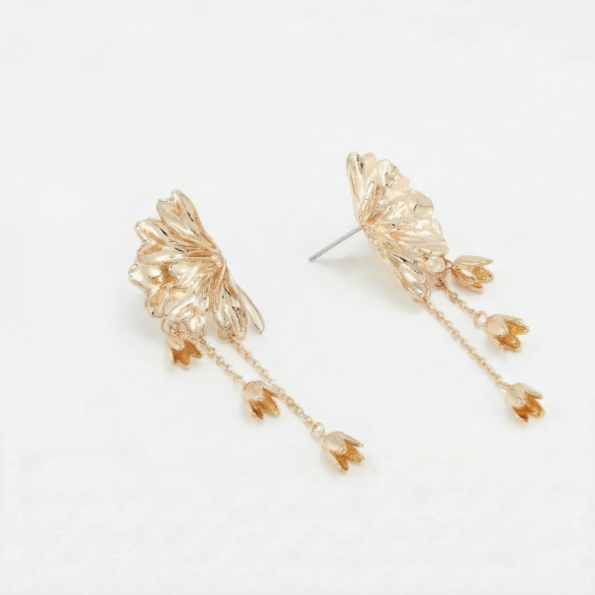 Longues boucles d'oreilles demi fleur chaine dorées