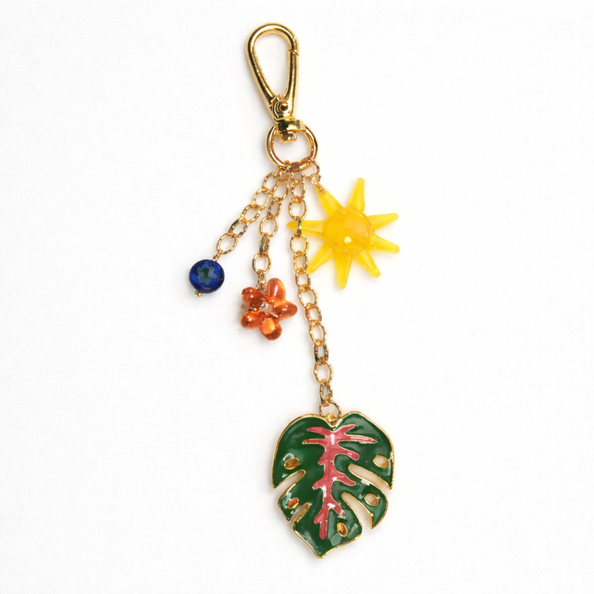 Porte-clés soleil, fleur et feuille de monstera