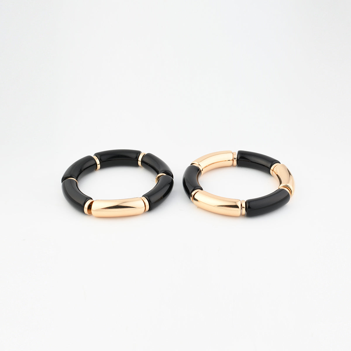 Set de 2 bracelets tubes noirs et dorés
